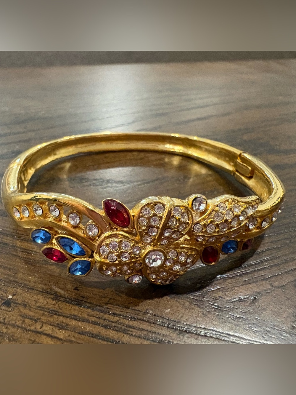 Gold-Tone Floral Crystal Bangle Bracelet with Red & Blue Accents